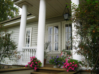 The porch of the estate decorated with flowers in vases