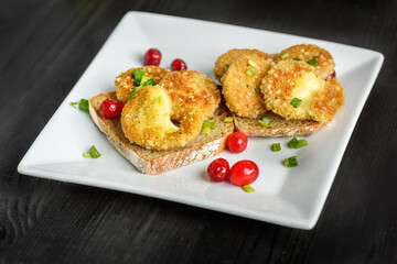 sandwich with fried camembert cheese and bacon