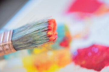 Closeup acrylic painting dirty messy brush with color