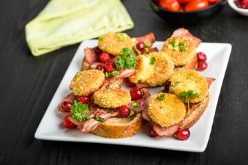 sandwich with fried camembert cheese and bacon