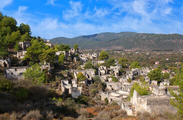 Fototapeta na wymiar Abandoned village of Kayakoy on Lycian Way in Mugla province, Turkey. Kayakoy, anciently known as Lebessos and later pronounced as Livissi is a village 8 km south of Fethiye.