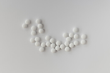 topview of melatonin tablets on a white creamy surface. dietary concept. dietary supplement close-up