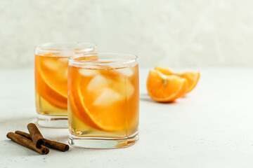 Orange vanilla  iced tea in glasses. Space for text.