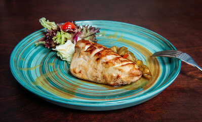 Grilled pork meat with pound cucumber and salad .