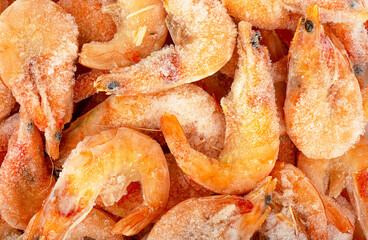 Full frame of frozen shrimps. Food background.