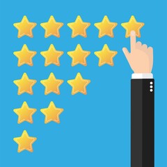 Hand putting five gold stars on blue background. Five stars quality rating icon. Feedbak stars.