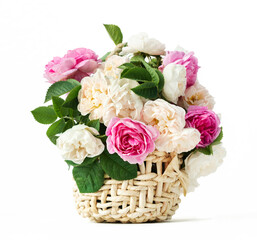 bouquet of beautiful flowers of rose in a basket isolated on a white background