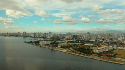 Aerial view of Panorama of Manila at sunset. Skyscrapers and business centers in a big city. Travel vacation concept