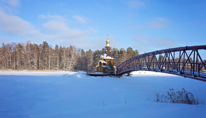 bridge in winter to the church