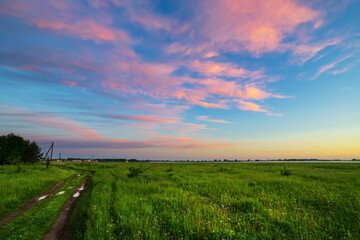 Obraz premium Beautiful summer sunrise in the meadows. Summer background.
