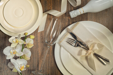 Festive wedding, birthday table setting with white polcelain cutlery, beautiful flowers,white...