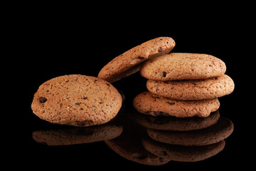 Chocolate chip cookies on a black background