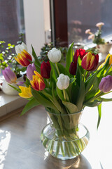 Fresh tulips inside a transparent vase