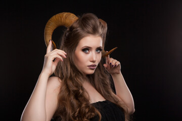 Obraz premium Portrait of an attractive demon woman with horns