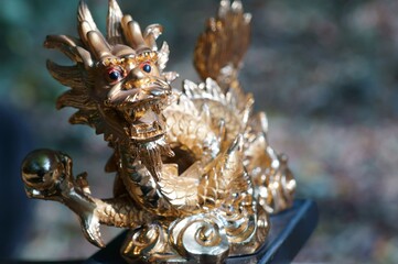 Close-up dragon figurine. A symbol of supernatural power and achievement.