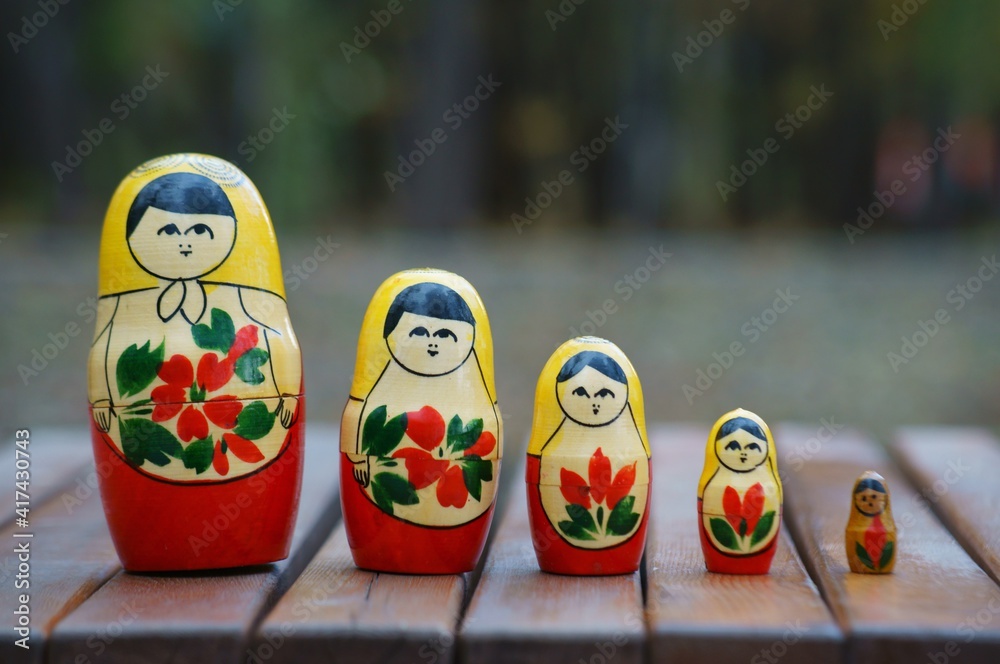 Wall mural Matryoshka figures are in the same row.