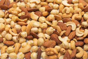 Mix of nuts isolated on white background. Top view.
