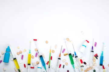 Masks, syringe, assortment of different pills and medical bottles. Concept of illness and treatment.