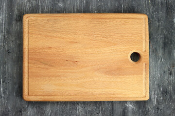 Rectangular cutting board on a gray table