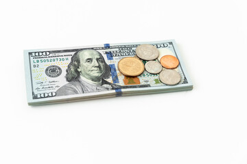Fototapeta premium US money on white. Coins and 100 dollar bills.