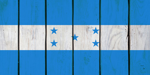 Honduran national flag on wooden texture
