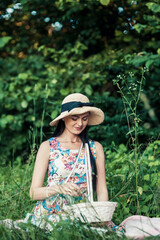 Obraz premium Girl on a picnic in the park.