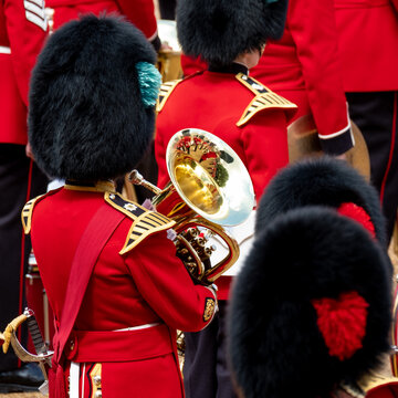 Trooping the Colour, military ceremony at Horse Guards Parade, Westminster. Coldstream Guards in the band, in red and black traditional uniform and bearskin hats.