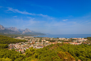 View of Kemer town on a coast of the Mediterranean sea in Antalya province, Turkey. Turkish Riviera. View from a mountain