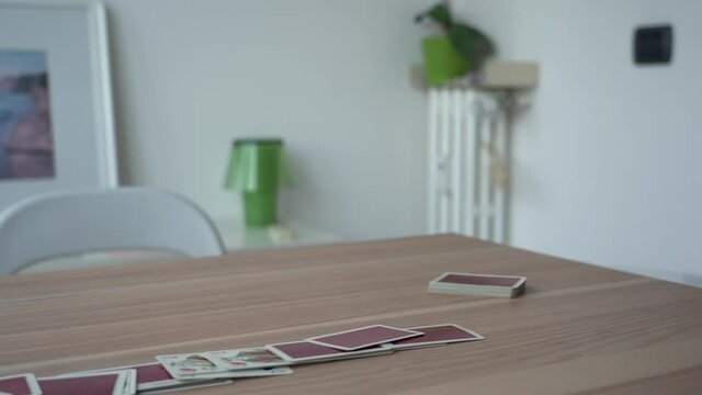 Collapsing house of cards. Slow motion.