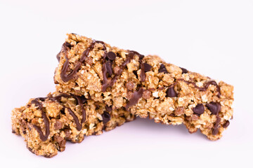 Two granola bars on a white background. Close-up.