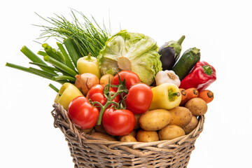 Obraz na płótnie Canvas Large basket of vegetables. Potatoes, tomatoes, onions, cabbage, paprika, zucchini, eggplant. Isolate on white background