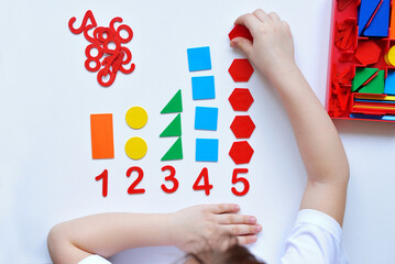 The child learns Number line and geometric shapes. The preschooler works with Montessori material....