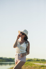 Fototapeta premium Pretty girl talking on the phone park