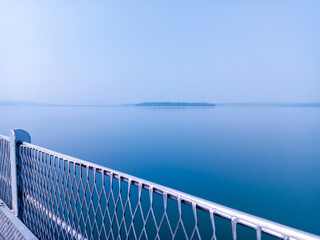 bridge over the river, steel wall on bridge, blue water