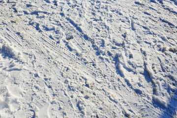 Snow with boot tracks and traces of the tread on it