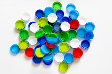 colorful plastic caps isolated on white background, recycle for environment concept
