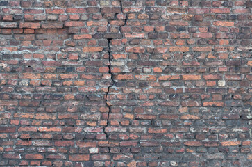 crack in orange old bricks wall