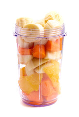 A Orange Mango and Carrot Smoothie Ready to be Blended