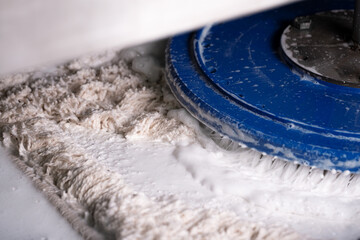 carpet washing machine with automatic round brushes in operation close up