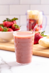 Strawberry Banana Smoothie on a Bright White Kitchen Cabinet