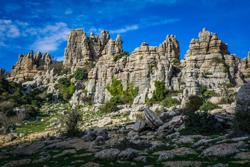 Fototapeta na wymiar Hiking the Torcal de Antequerra National Park in Andalusia, Spain. This national is known for its unusual karst landforms, made of limestone