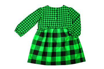 Summer dress isolated. Close-up of a beautiful green and black checkered little girl dress with long sleeves isolated on a white background. Children autumn fashion.