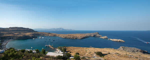 Beautiful panoramic view of Lindos bay with beach, rocks and mediterranean sea. Rhodes, Dodecanese, Greece.