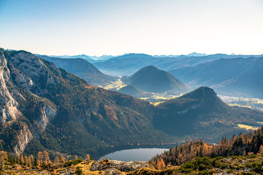 Paragliding flying over mountain peaks, Altaussee, Liezen, Styria, Austria