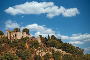 Fototapeta na wymiar old ruined castle on hill landscape Parga Greece