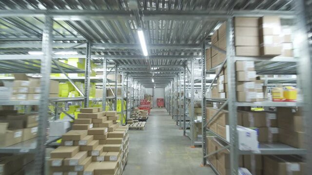 Warehouse or stock of materials, racks, boxes, containers, bundles, pack, packet, package. Shelves with goods or commodity