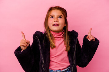 Little caucasian girl isolated on pink background