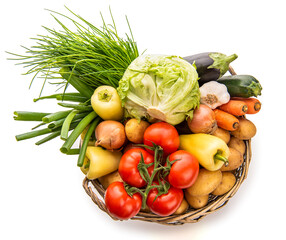 Large basket of vegetables. View from above. Potatoes, tomatoes, onions, cabbage, paprika, zucchini, eggplant. Isolate on white background