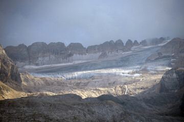 The Marmolada glacier in summer: Aerial view of the last and the only glacier of the Dolomites, UNESCO heritage, near the town of Canazei - August 2018 - Evidence of global warming and melting glacier