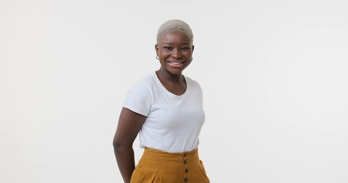 Happy african american woman posing over white background